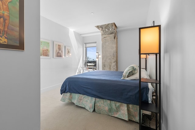 carpeted bedroom with baseboards
