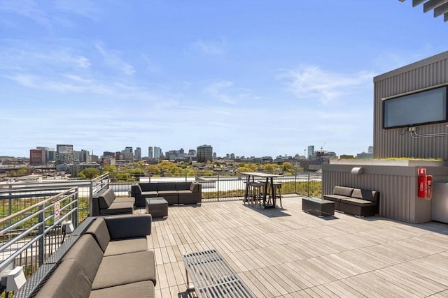 view of patio / terrace featuring a view of city and an outdoor hangout area