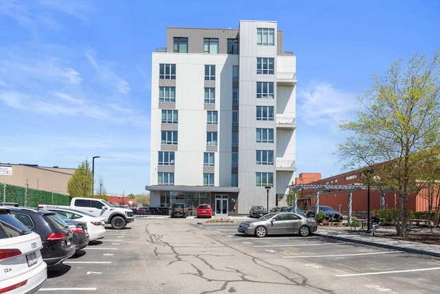 view of property with uncovered parking