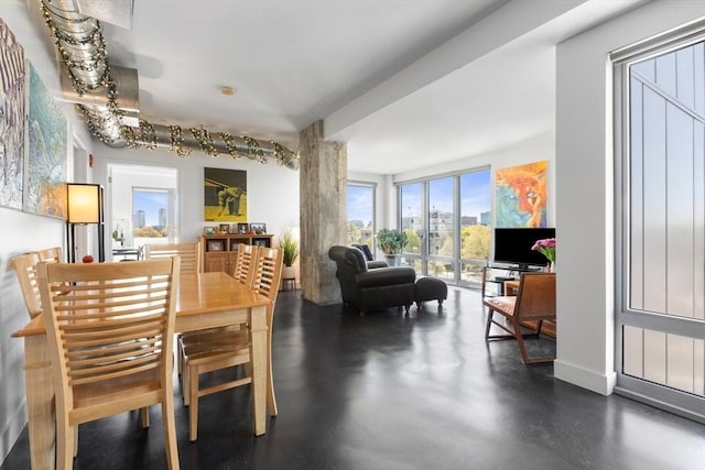 dining area featuring concrete floors