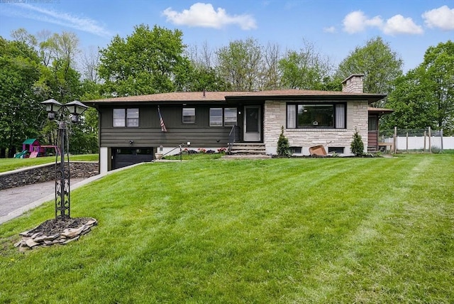 735 Union St, Leominster, MA 01453 - view of front facade with a chimney, a garage, entry steps, driveway, and stone siding