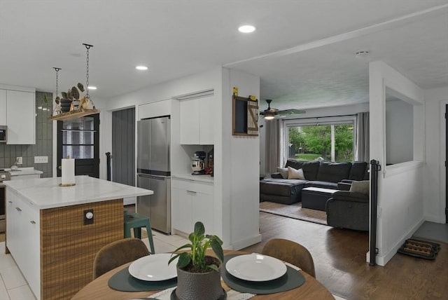 735 Union St, Leominster, MA 01453 - kitchen featuring stainless steel appliances, modern cabinets, white cabinets, ceiling fan, and recessed lighting
