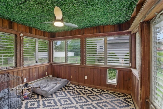 735 Union St, Leominster, MA 01453 - sunroom with a ceiling fan, wooden walls, and carpet