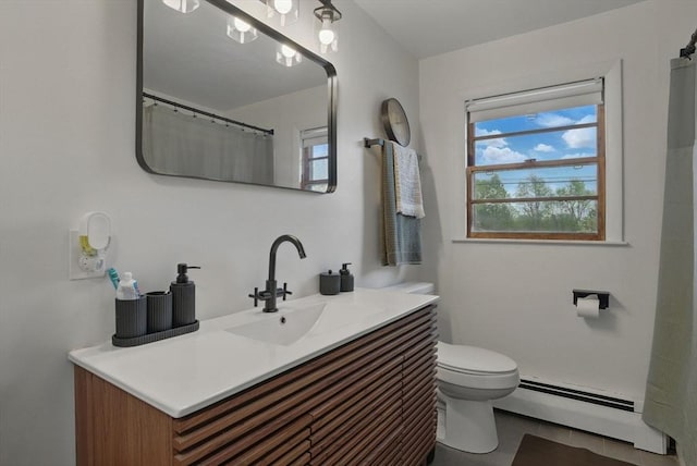 735 Union St, Leominster, MA 01453 - full bath with a baseboard radiator, toilet, vanity, and tile patterned floors