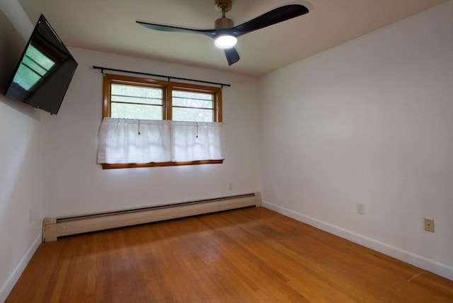 735 Union St, Leominster, MA 01453 - empty room featuring a baseboard heating unit, wood finished floors, a ceiling fan, and baseboards