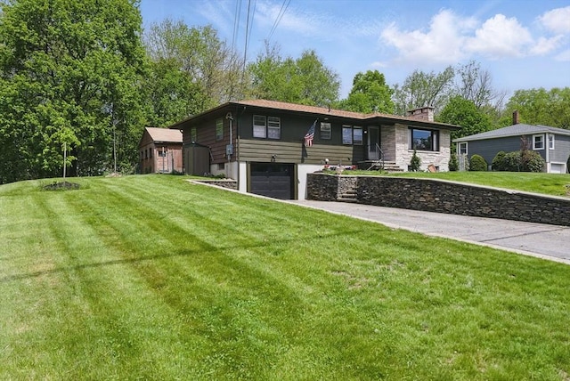 735 Union St, Leominster, MA 01453 - view of front of property with a garage, a front yard, concrete driveway, and a chimney