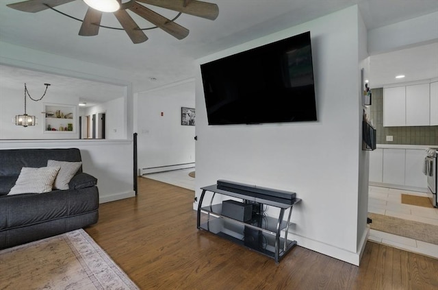 735 Union St, Leominster, MA 01453 - living room with a ceiling fan, wood finished floors, a baseboard heating unit, and baseboards