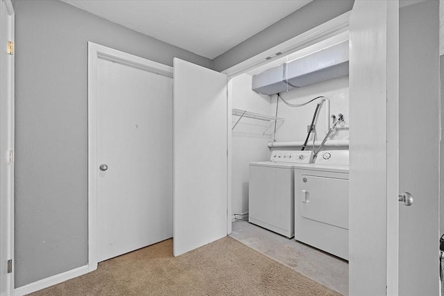 clothes washing area featuring washing machine and dryer