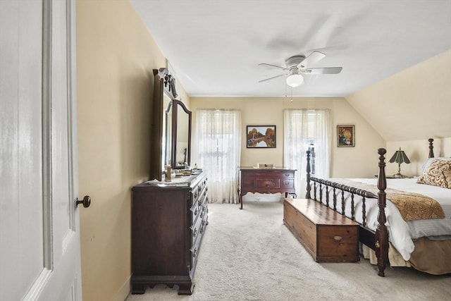 bedroom featuring light colored carpet and ceiling fan