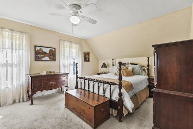 bedroom with vaulted ceiling, a ceiling fan, and carpet