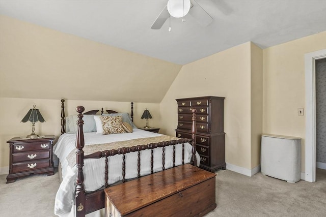 bedroom featuring baseboards, a ceiling fan, vaulted ceiling, and carpet