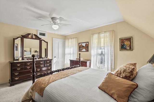 bedroom featuring ceiling fan, lofted ceiling, and carpet