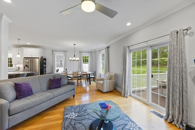 7 Garvey Rd Unit 7, Woburn, MA 01801 - living area with crown molding, a ceiling fan, recessed lighting, a chandelier, and light wood-style floors