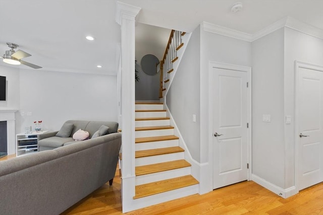 7 Garvey Rd Unit 7, Woburn, MA 01801 - stairway featuring wood finished floors, crown molding, recessed lighting, a fireplace, and ceiling fan