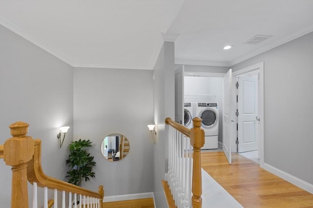 7 Garvey Rd Unit 7, Woburn, MA 01801 - hall featuring washing machine and dryer, crown molding, light wood-type flooring, an upstairs landing, and recessed lighting