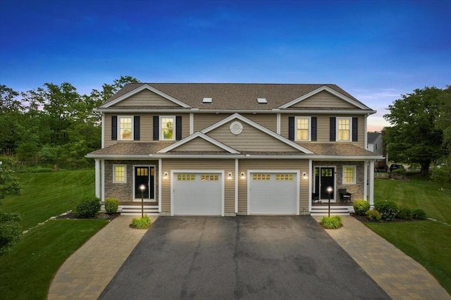 7 Garvey Rd Unit 7, Woburn, MA 01801 - view of front of home featuring asphalt driveway, a yard, a shingled roof, and a garage