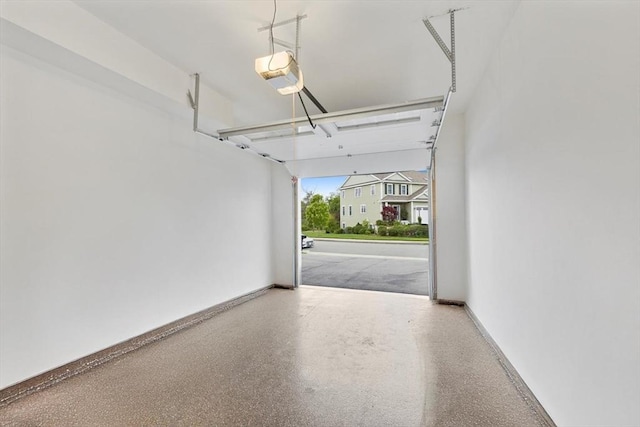 7 Garvey Rd Unit 7, Woburn, MA 01801 - garage featuring a garage door opener and baseboards