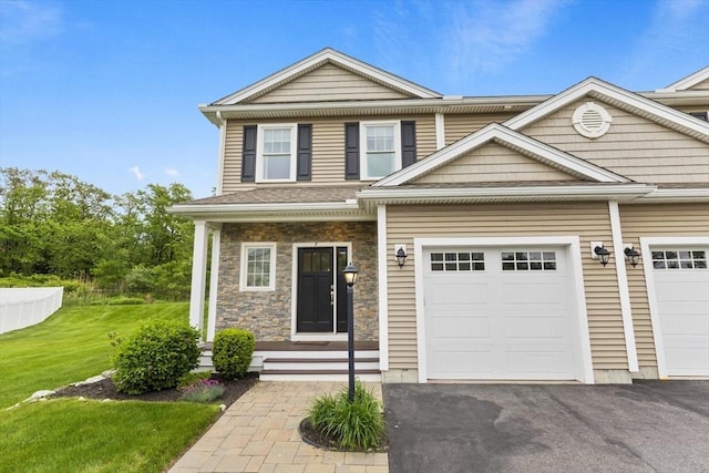 7 Garvey Rd Unit 7, Woburn, MA 01801 - townhome / multi-family property with driveway, a front lawn, stone siding, and a garage
