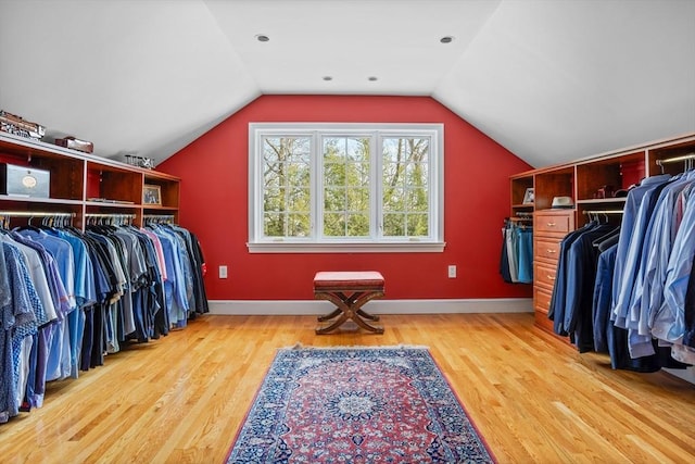 spacious closet with hardwood / wood-style flooring and lofted ceiling