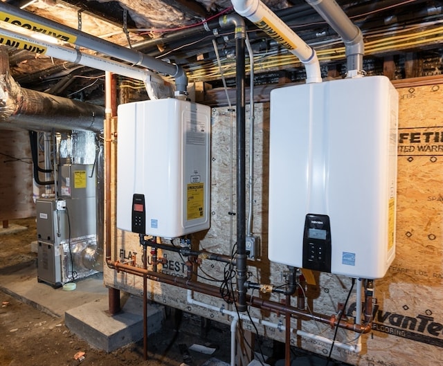 utility room with heating unit and tankless water heater