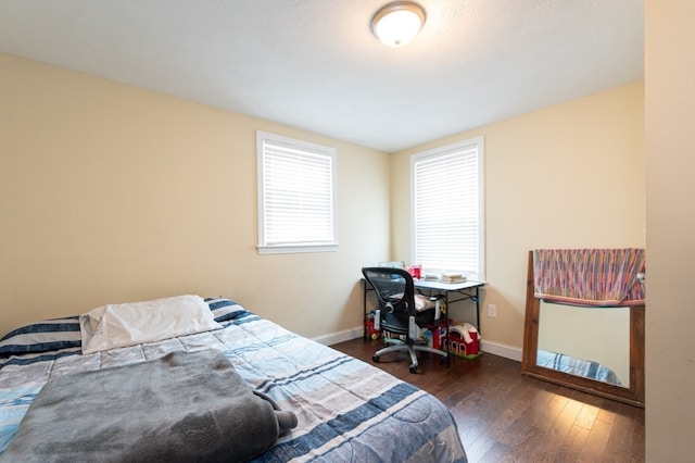 bedroom featuring dark hardwood / wood-style flooring