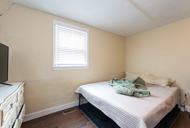 bedroom featuring dark hardwood / wood-style floors