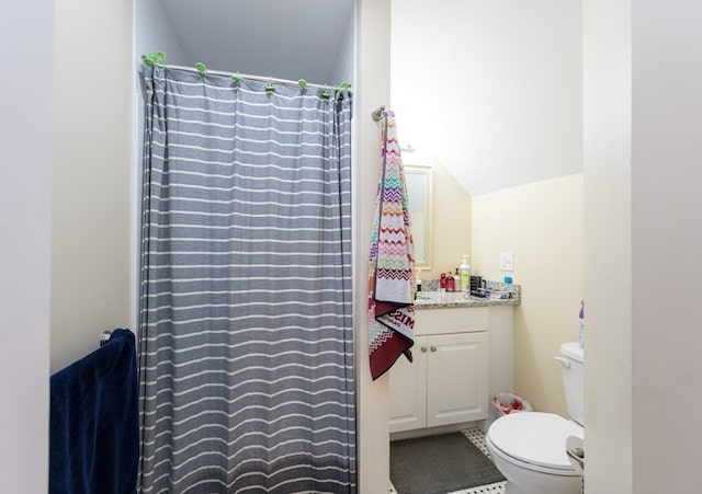 bathroom featuring tile patterned floors, vanity, and toilet