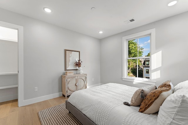 bedroom with light wood-type flooring