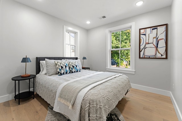 bedroom with light hardwood / wood-style floors