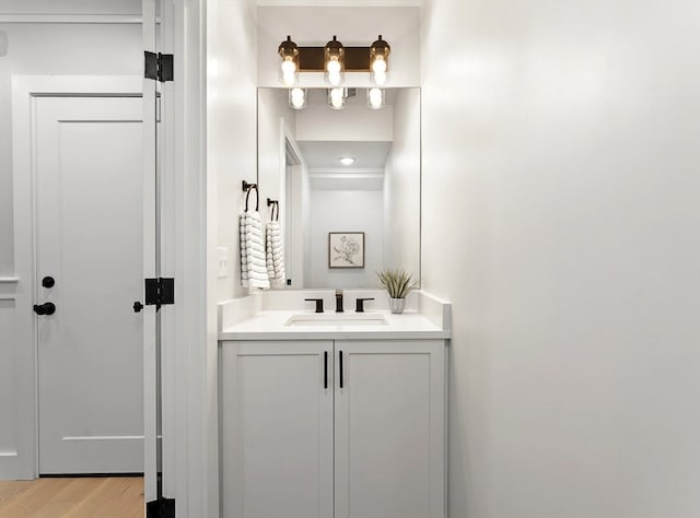 bathroom featuring vanity and hardwood / wood-style floors