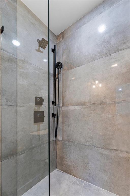 bathroom with tiled shower