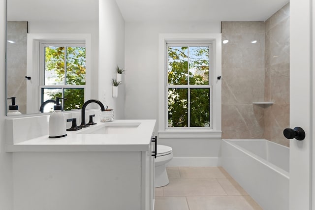 full bathroom with tile patterned floors, plenty of natural light, vanity, and toilet