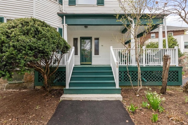 doorway to property with a porch