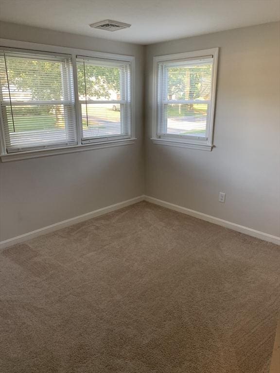 spare room with carpet floors