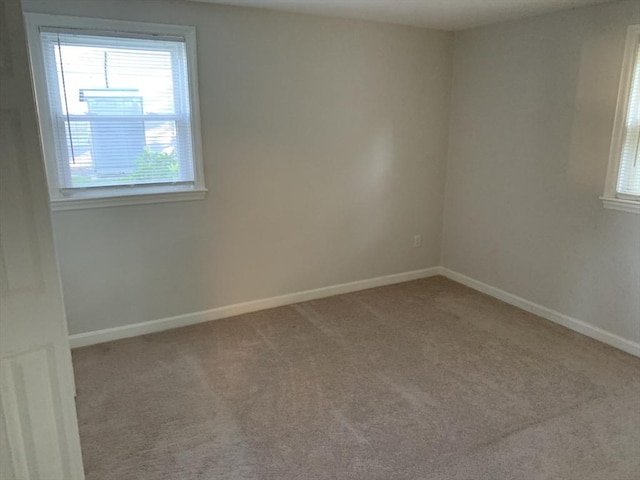 spare room featuring carpet