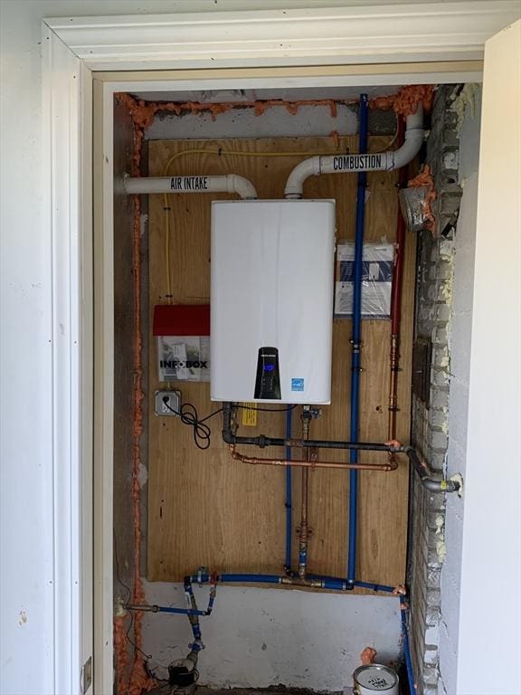 utility room with water heater