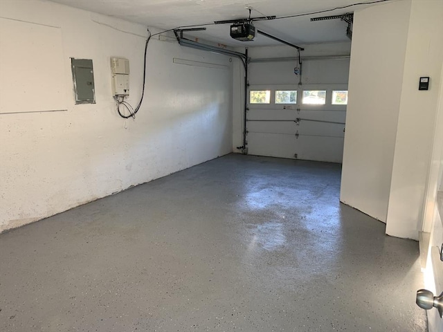 garage featuring a garage door opener and electric panel