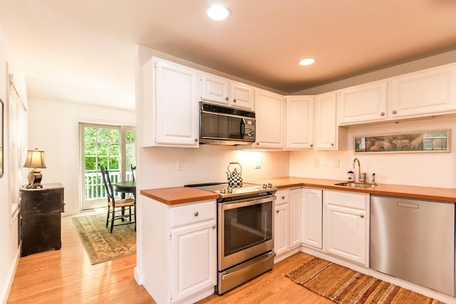 15 Hampton Ct Unit 15, Mashpee, MA 02649 - kitchen featuring stainless steel appliances, light wood-style floors, white cabinets, recessed lighting, and wood counters