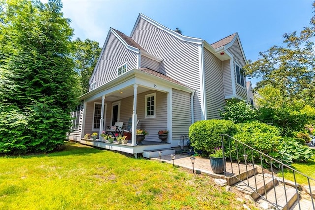 15 Hampton Ct Unit 15, Mashpee, MA 02649 - view of front of home with a front lawn and a porch