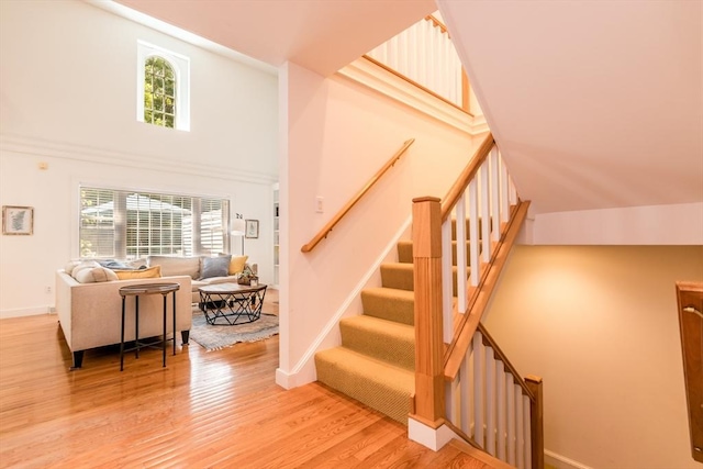 15 Hampton Ct Unit 15, Mashpee, MA 02649 - staircase with wood finished floors and a towering ceiling