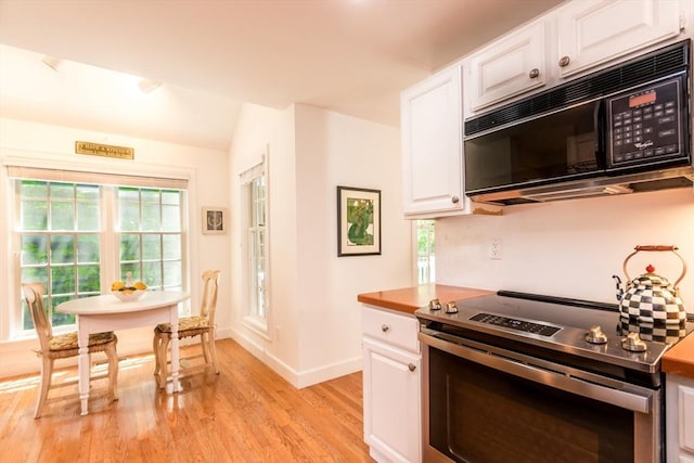 15 Hampton Ct Unit 15, Mashpee, MA 02649 - kitchen featuring black microwave, electric stove, light wood-style floors, white cabinets, and vaulted ceiling