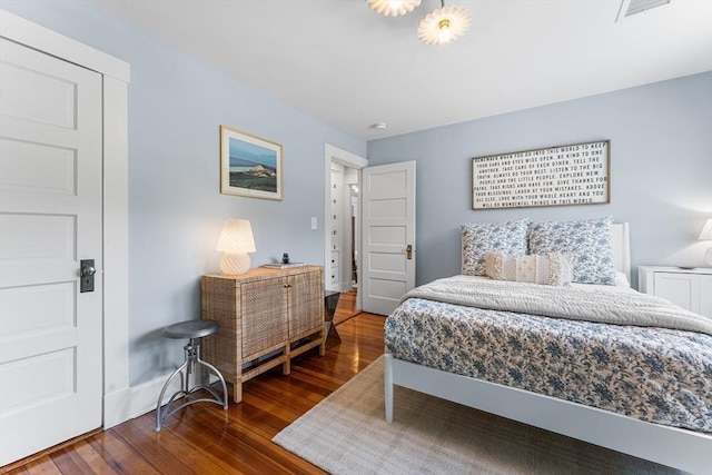 bedroom featuring wood finished floors