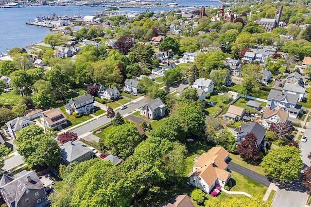 aerial overview of property's location featuring a nearby body of water and nearby suburban area