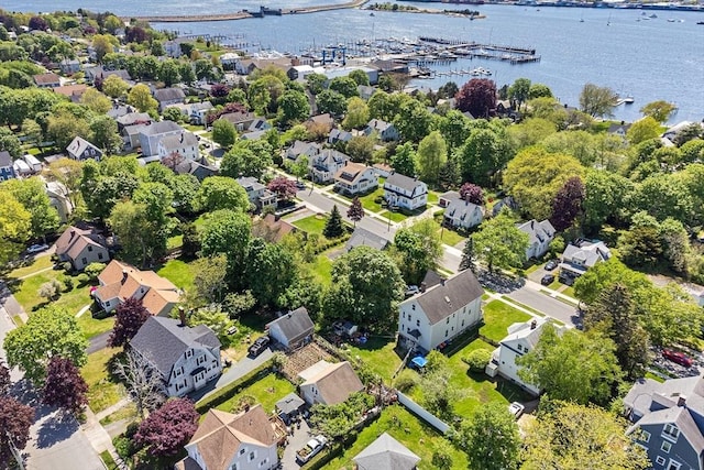 aerial view of property's location featuring nearby suburban area and a large body of water