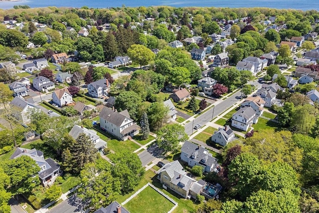 aerial overview of property's location with nearby suburban area and a large body of water