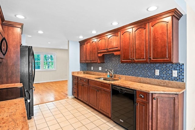 10 Freedom Holw Unit 10, Salem, MA 01970 - kitchen featuring black dishwasher, decorative backsplash, light tile patterned floors, recessed lighting, and light stone countertops