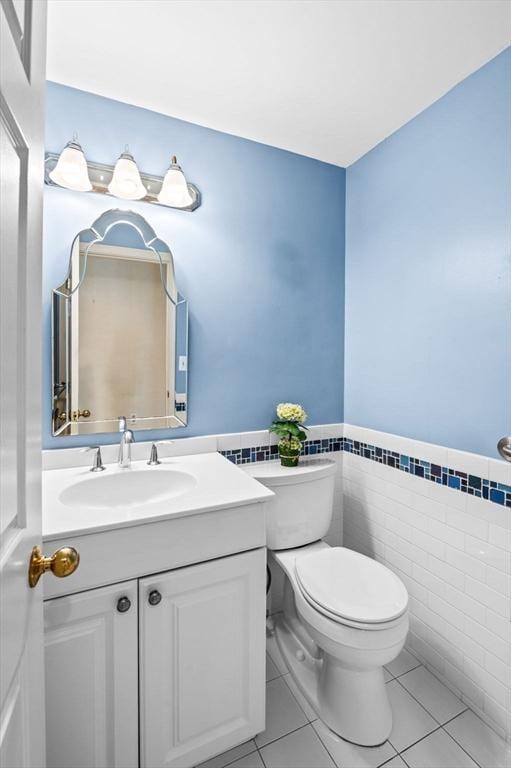 10 Freedom Holw Unit 10, Salem, MA 01970 - bathroom with tile patterned floors, tile walls, wainscoting, and vanity