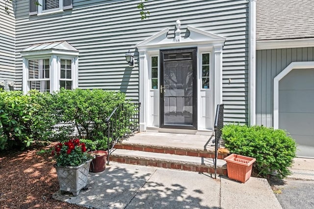 10 Freedom Holw Unit 10, Salem, MA 01970 - entrance to property with a garage and a shingled roof