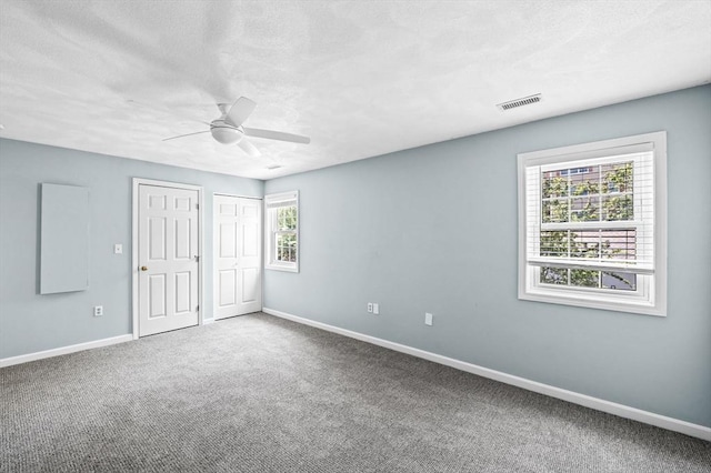 10 Freedom Holw Unit 10, Salem, MA 01970 - unfurnished bedroom with carpet, ceiling fan, and a textured ceiling