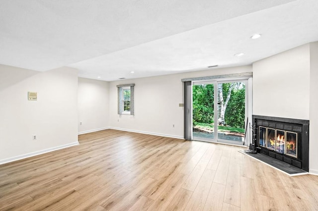 10 Freedom Holw Unit 10, Salem, MA 01970 - unfurnished living room featuring a glass covered fireplace, light wood-style flooring, and recessed lighting